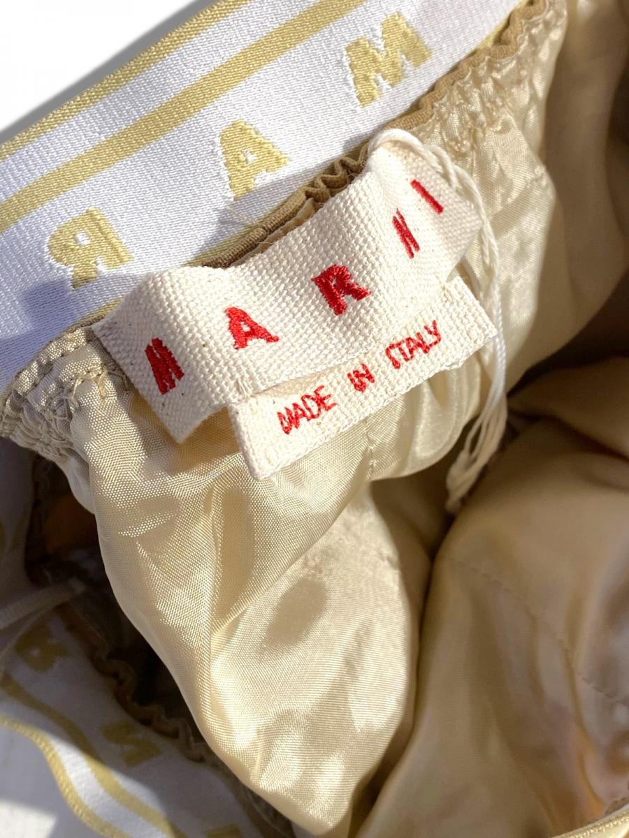 トロピカルウール製フレアワイドパンツ